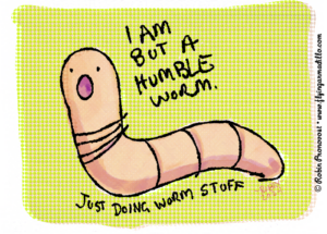 A pink worm on a green background saying "I am but a humble worm just doing worm stuff"
